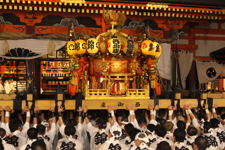 People carrying a Shinto shrine to the main shrine of Yasaka Shrine